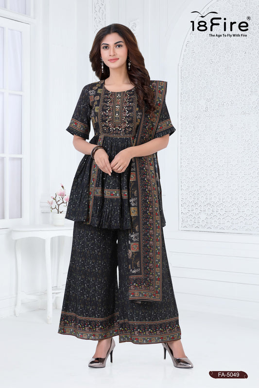 This is a black printed three-piece outfit. The set includes a short Kurti-style top, wide-leg palazzo pants, and a dupatta (scarf)